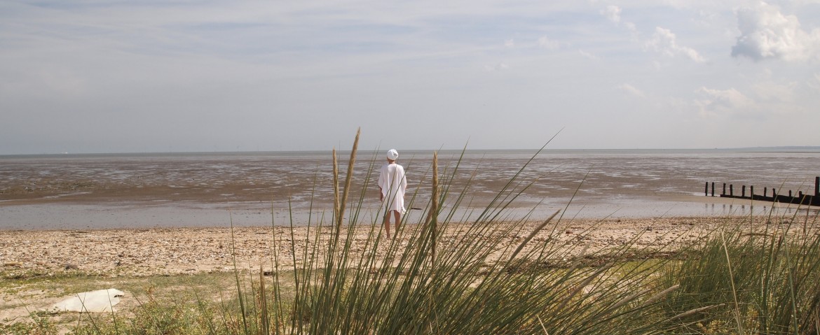 Kundalini yogi facing the sea