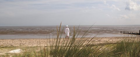 Kundalini yogi facing the sea